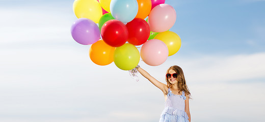 Image showing happy girl with colorful balloons