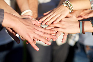 Image showing close up of people hands on top