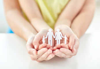 Image showing close up of woman and girl hands with paper family