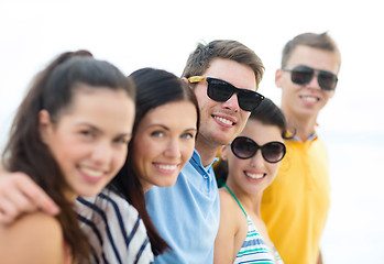 Image showing group of happy friends on beach