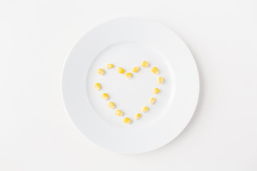 Image showing close up of plate with corn  in heart shape 