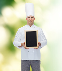 Image showing happy male chef cook holding blank menu board