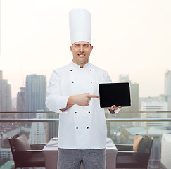 Image showing happy male chef cook showing with tablet pc