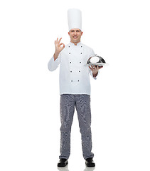 Image showing happy male chef cook with cloche showing ok sign