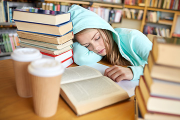 Image showing student or woman with books sleeping in library