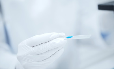 Image showing close up of scientist hand with test sample in lab