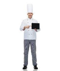 Image showing happy male chef cook showing with tablet pc