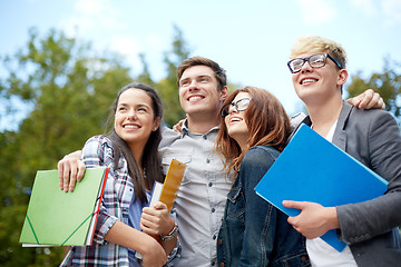 Image showing group of happy students with folders outdoors