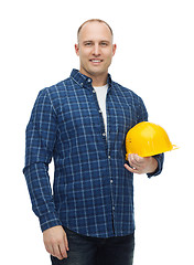 Image showing smiling man in helmet with gloves