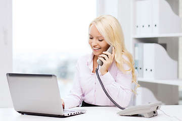 Image showing smiling businesswoman or student calling on phone