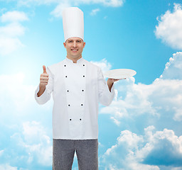 Image showing happy male chef cook showing thumbs up and plate