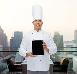 Image showing happy male chef cook showing with tablet pc