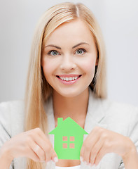 Image showing woman with illustration of eco house