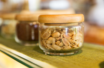 Image showing close up of jars with peanuts at grocery store