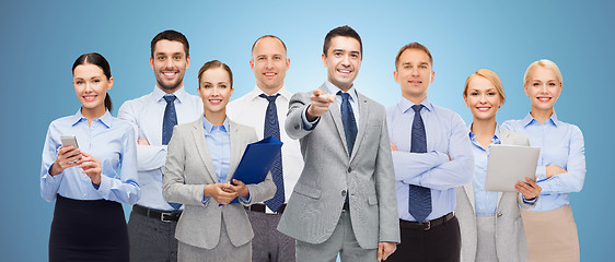 Image showing group of happy business people pointing at you