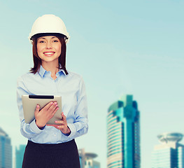 Image showing young smiling businesswoman in white helmet