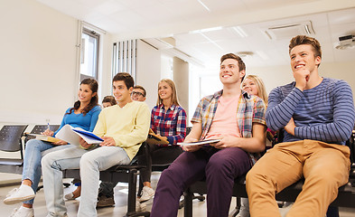 Image showing group of smiling students in lecture hall