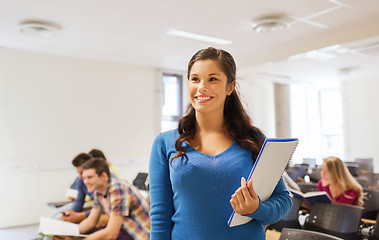 Image showing group of smiling students in lecture hall