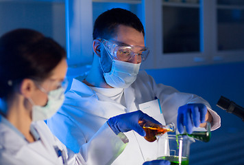 Image showing close up of scientists making test in lab