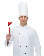 Image showing happy male chef cook holding ladle