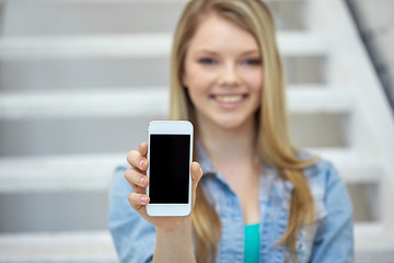 Image showing close up of happy teenage girl showing smartphone