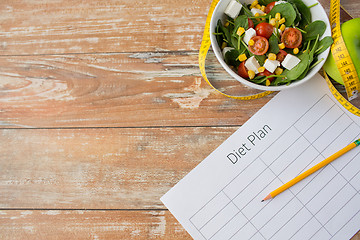 Image showing close up of diet plan and food on table