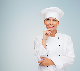 Image showing smiling female chef dreaming