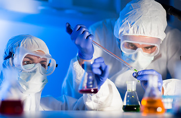 Image showing close up of scientists making test in lab