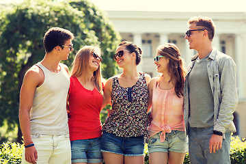 Image showing group of smiling friends outdoors