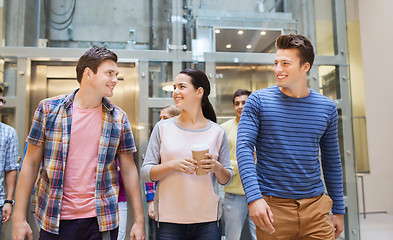 Image showing group of smiling students with paper coffee cups