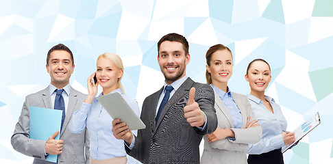 Image showing group of smiling businessmen showing thumbs up