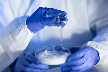 Image showing close up of scientists hands with chemicals in lab