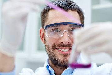 Image showing young scientist making test or research in lab