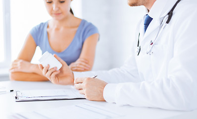 Image showing patient and doctor prescribing medication