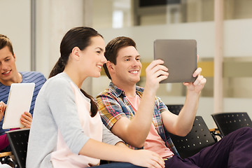 Image showing group of smiling students with tablet pc