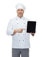 Image showing happy male chef cook showing with tablet pc