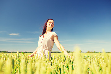 Image showing smiling young woman on cereal field