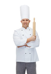 Image showing happy male chef cook holding rolling pin