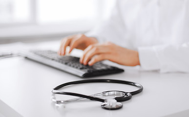 Image showing male doctor typing on the keyboard