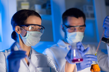 Image showing close up of scientists making test in lab