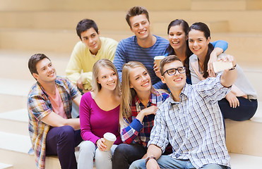 Image showing group of students with smartphone and coffee cup