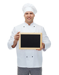 Image showing happy male chef cook holding blank menu board