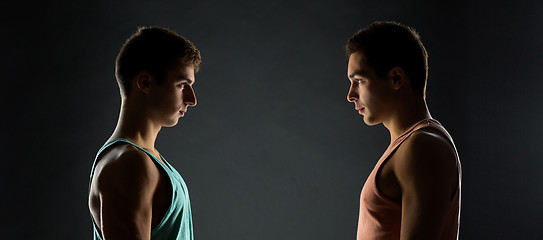 Image showing young men looking to each other