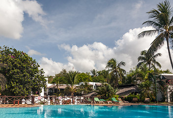 Image showing Swimming pool, palm trees and sky