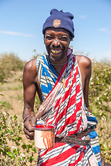 Image showing Masai Mara, Kenya, Africa - February 12, 2010  shaman with a cup of cow blood in traditional clothes