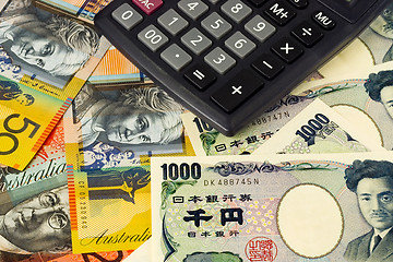 Image showing Forex - Australia and Japanese currency pair with calculator

