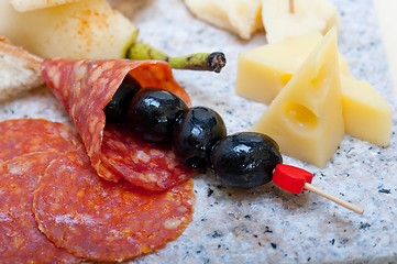 Image showing mix cold cut on a stone with fresh pears