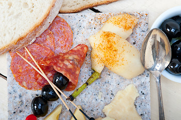 Image showing mix cold cut on a stone with fresh pears