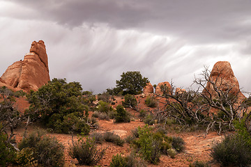 Image showing Rain Streaks Clouds Rock Formations Utah Juniper Trees
