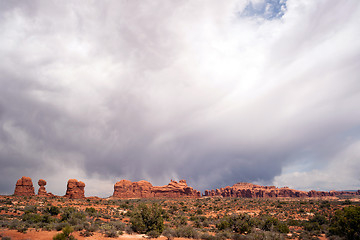 Image showing Rain Streaks Clouds Above Rock Formations Utah Juniper Trees